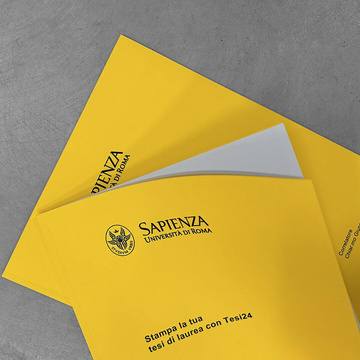 Due tesi con la rilegatura brossurata in cartoncino giallo, una aperta